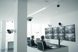 A professional investigator discreetly observing a business environment